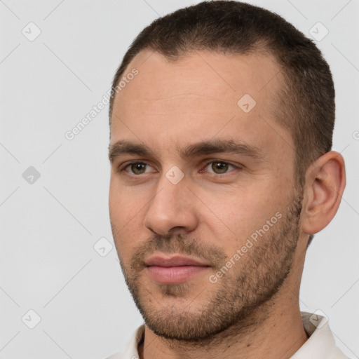 Joyful white young-adult male with short  brown hair and brown eyes