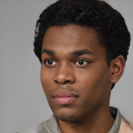Neutral black young-adult male with short  black hair and brown eyes