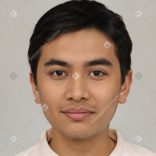 Joyful latino young-adult male with short  black hair and brown eyes