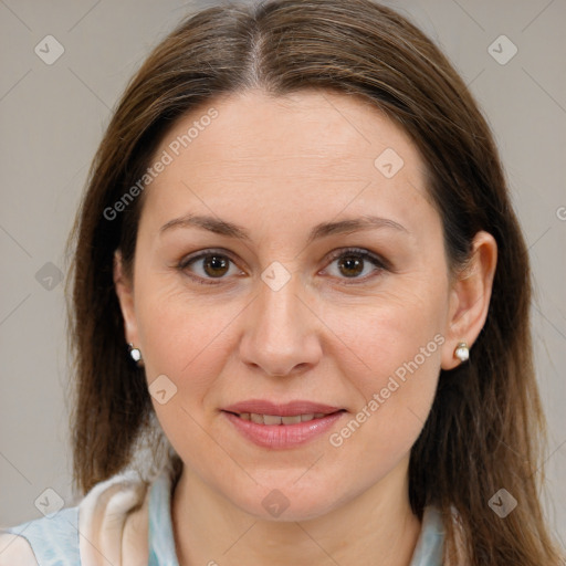 Joyful white adult female with medium  brown hair and brown eyes