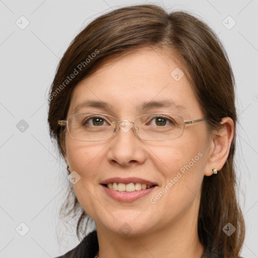 Joyful white adult female with medium  brown hair and grey eyes