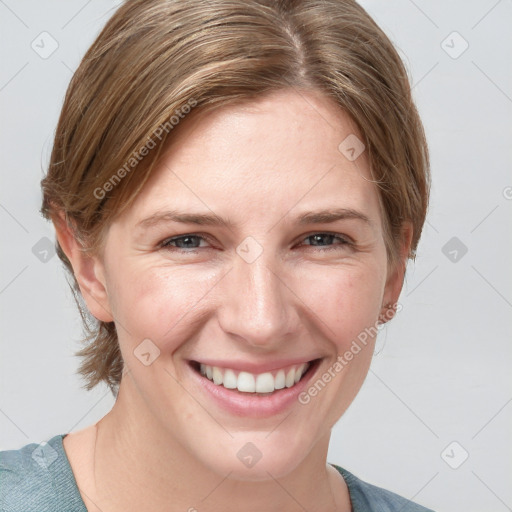 Joyful white young-adult female with medium  brown hair and blue eyes