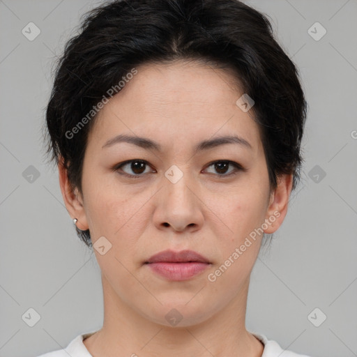 Joyful asian young-adult female with short  brown hair and brown eyes