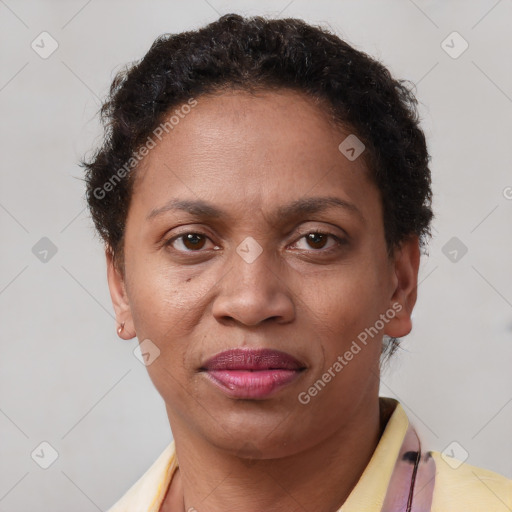 Joyful latino adult female with short  brown hair and brown eyes