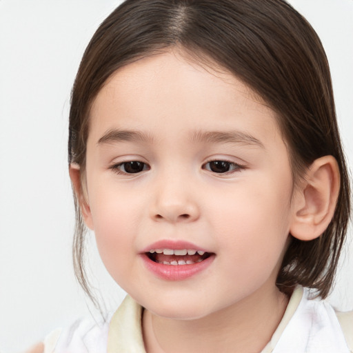 Joyful white child female with medium  brown hair and brown eyes