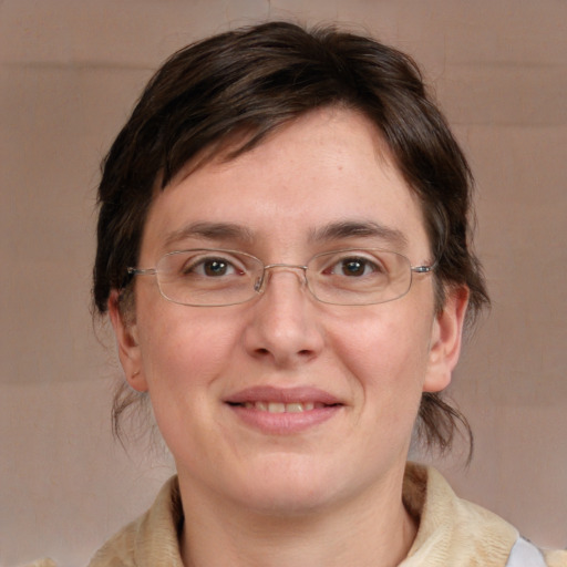 Joyful white adult female with medium  brown hair and grey eyes