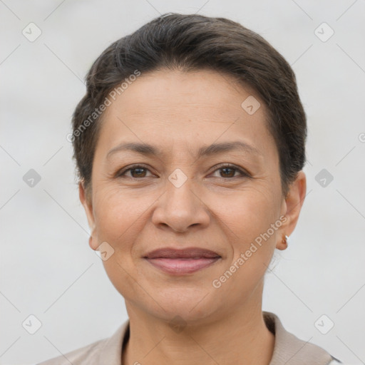 Joyful white adult female with short  brown hair and brown eyes