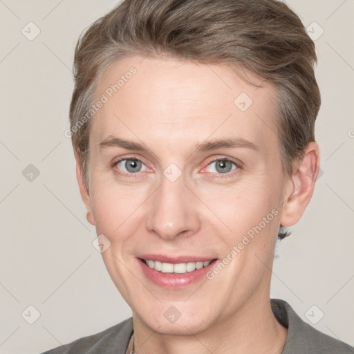 Joyful white adult female with short  brown hair and grey eyes