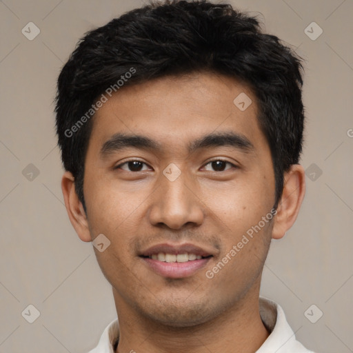 Joyful asian young-adult male with short  black hair and brown eyes