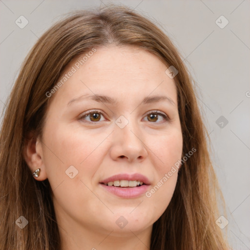 Joyful white young-adult female with long  brown hair and green eyes