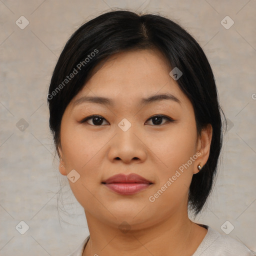 Joyful asian young-adult female with medium  black hair and brown eyes