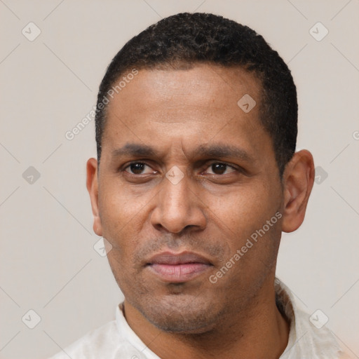 Neutral latino adult male with short  black hair and brown eyes
