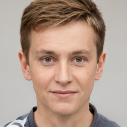 Joyful white adult male with short  brown hair and grey eyes