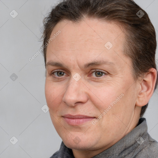 Joyful white adult female with short  brown hair and brown eyes