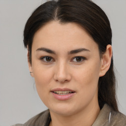 Joyful asian young-adult female with medium  brown hair and brown eyes