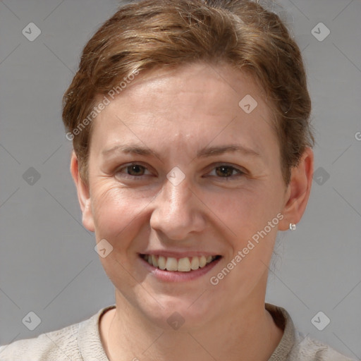 Joyful white adult female with short  brown hair and grey eyes