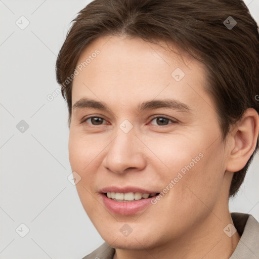 Joyful white young-adult female with short  brown hair and brown eyes