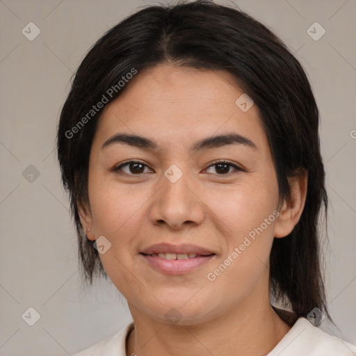 Joyful asian young-adult female with medium  black hair and brown eyes