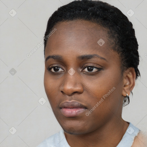 Neutral black young-adult female with short  black hair and brown eyes