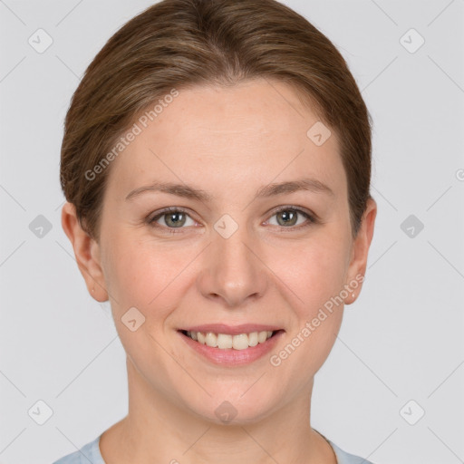 Joyful white young-adult female with short  brown hair and grey eyes