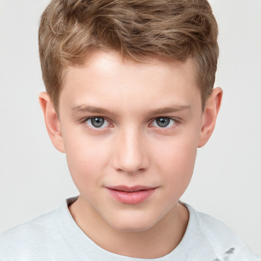 Joyful white child male with short  brown hair and grey eyes