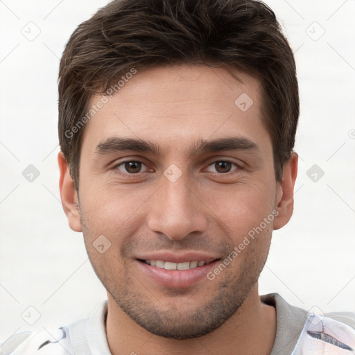 Joyful white young-adult male with short  brown hair and brown eyes