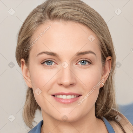 Joyful white young-adult female with medium  brown hair and blue eyes