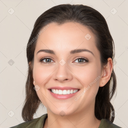 Joyful white young-adult female with medium  brown hair and brown eyes