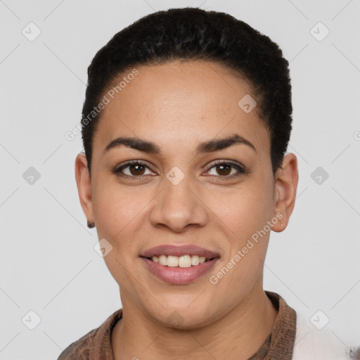 Joyful latino young-adult female with short  black hair and brown eyes