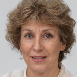 Joyful white middle-aged female with medium  brown hair and brown eyes