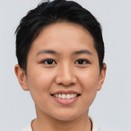 Joyful asian young-adult female with short  brown hair and brown eyes