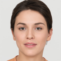 Neutral white young-adult female with short  brown hair and brown eyes