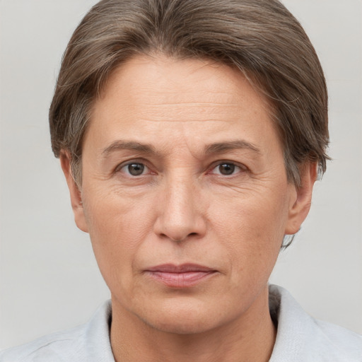 Joyful white adult female with short  brown hair and brown eyes