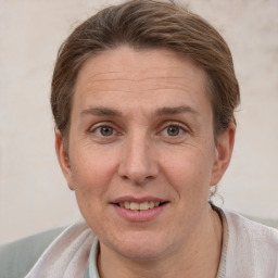 Joyful white adult female with short  brown hair and grey eyes