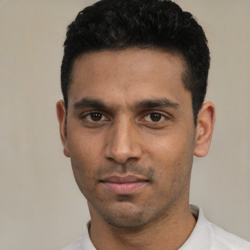 Neutral white young-adult male with short  black hair and brown eyes