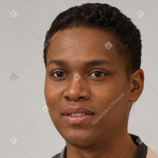 Joyful black young-adult female with short  black hair and brown eyes