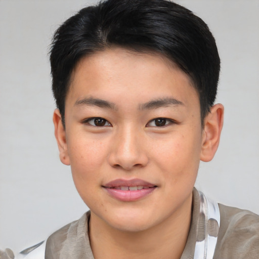 Joyful asian young-adult male with short  brown hair and brown eyes