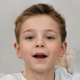 Joyful white child male with short  brown hair and brown eyes