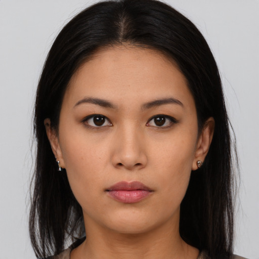 Neutral asian young-adult female with long  brown hair and brown eyes