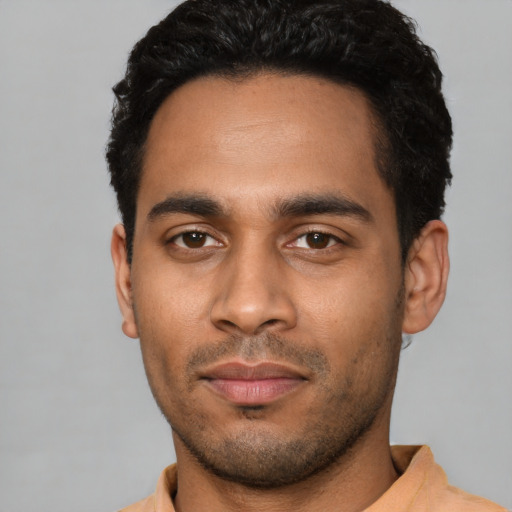 Neutral latino young-adult male with short  black hair and brown eyes