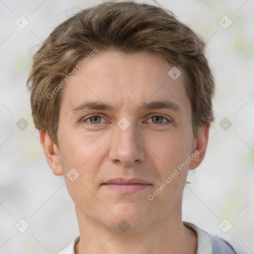 Joyful white adult male with short  brown hair and grey eyes