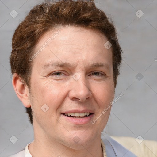 Joyful white adult male with short  brown hair and grey eyes