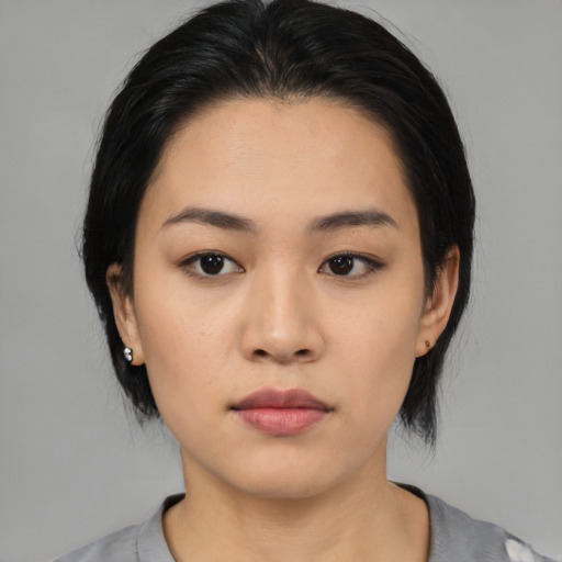 Neutral asian young-adult female with medium  black hair and brown eyes