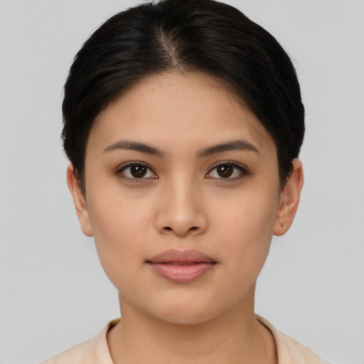 Joyful asian young-adult female with short  black hair and brown eyes