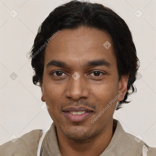 Joyful latino young-adult male with short  black hair and brown eyes