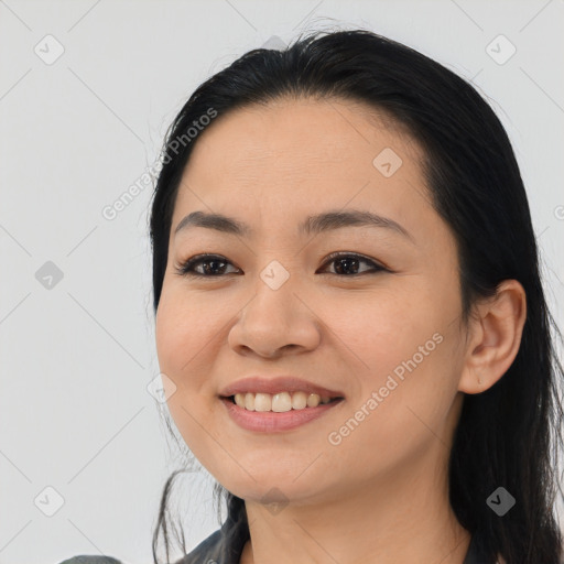 Joyful asian young-adult female with medium  black hair and brown eyes