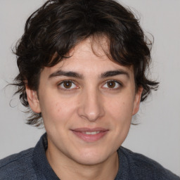 Joyful white young-adult male with medium  brown hair and brown eyes