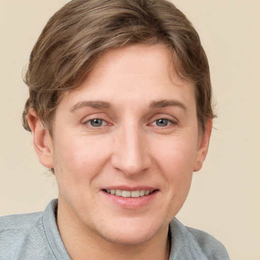 Joyful white adult female with short  brown hair and grey eyes