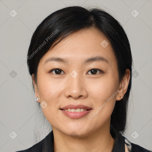 Joyful asian young-adult female with medium  black hair and brown eyes