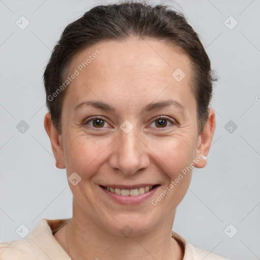 Joyful white adult female with short  brown hair and brown eyes